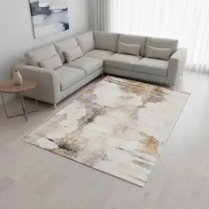 Photo of Beige Gray And Ivory Abstract Washable Area Rug With UV Protection