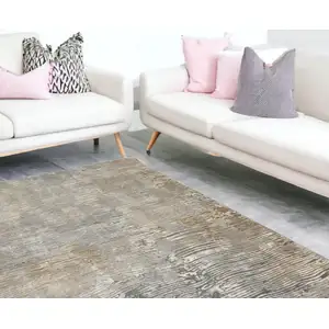 Photo of Beige Gray And Light Taupe Abstract Distressed Area Rug