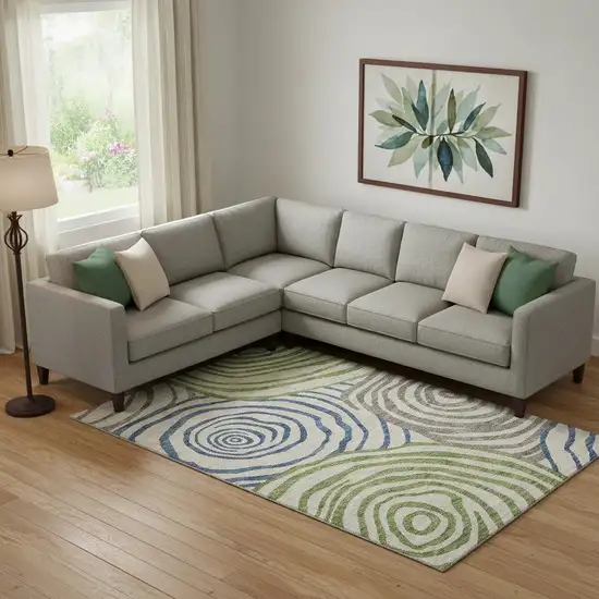 Beige Green And Blue Abstract Washable Area Rug With UV Protection Photo 1