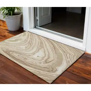 Photo of Beige Green And Brown Abstract Washable Indoor Outdoor Area Rug