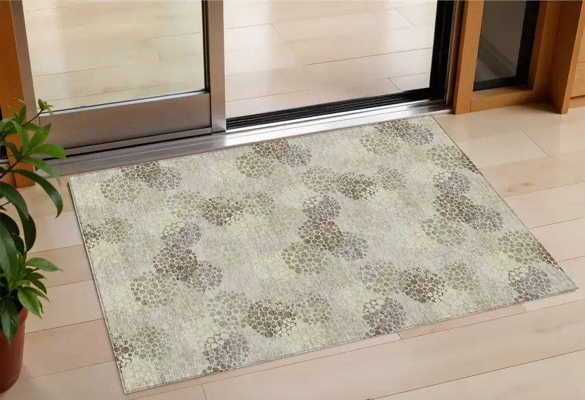 Beige Green And Ivory Polka Dot Washable Indoor Outdoor Area Rug Photo 1