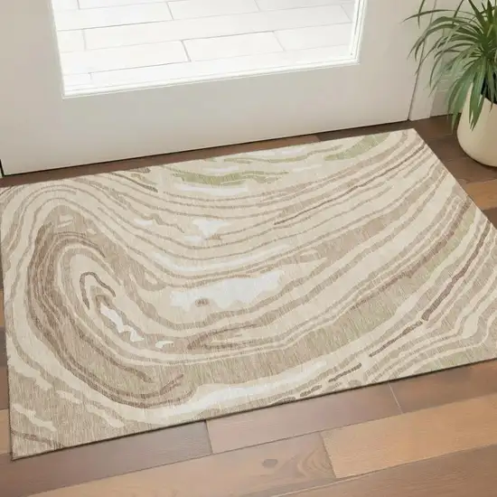 Beige Green And Taupe Abstract Washable Area Rug With UV Protection Photo 1