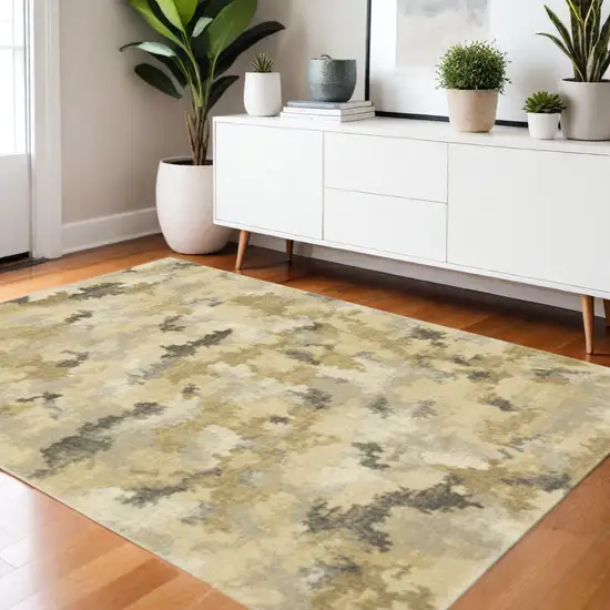 3' X 5' Beige Grey And Gold Abstract Power Loom Stain Resistant Area Rug Photo 1