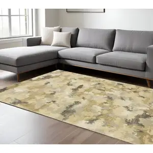 Photo of Beige Grey And Gold Abstract Power Loom Stain Resistant Area Rug