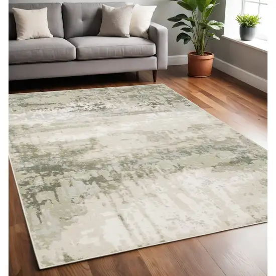 Beige And Green Abstract Distressed Area Rug Photo 1
