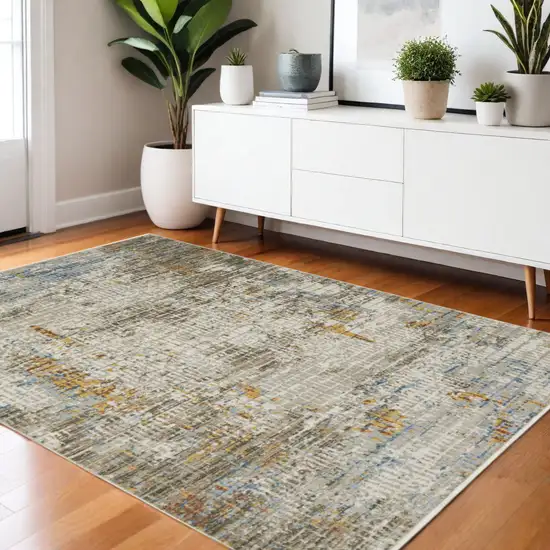 Beige Grey Brown Gold Red And Blue Abstract Power Loom Stain Resistant Area Rug With Fringe Photo 1