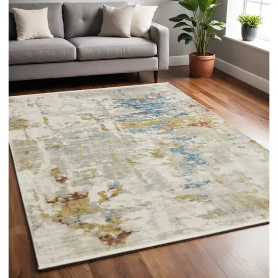 Beige Grey Gold Blue Rust And Teal Abstract Power Loom Stain Resistant Area Rug With Fringe Photo 1