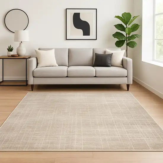 6' X 9' Beige Grey Ivory Tan And Brown Abstract Power Loom Stain Resistant Area Rug Photo 1