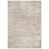 Photo of Beige Grey Ivory Tan And Brown Abstract Power Loom Stain Resistant Area Rug