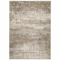 Photo of Beige Grey Ivory Tan And Brown Abstract Power Loom Stain Resistant Area Rug
