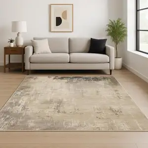 Photo of Beige Grey Ivory Tan And Brown Abstract Power Loom Stain Resistant Area Rug