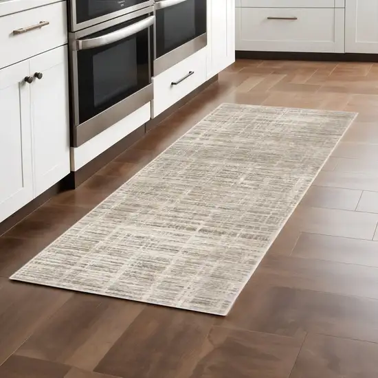 2' X 8' Beige Grey Ivory Tan And Brown Abstract Power Loom Stain Resistant Runner Rug Photo 1