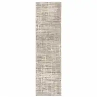 Photo of Beige Grey Ivory Tan And Brown Abstract Power Loom Stain Resistant Runner Rug
