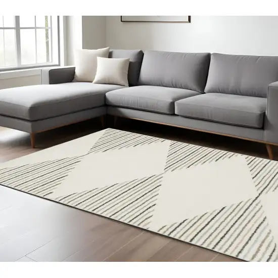 6' X 9' Beige Grey Sage Green Pale Blue Brown And Charcoal Geometric Power Loom Stain Resistant Area Rug Photo 1