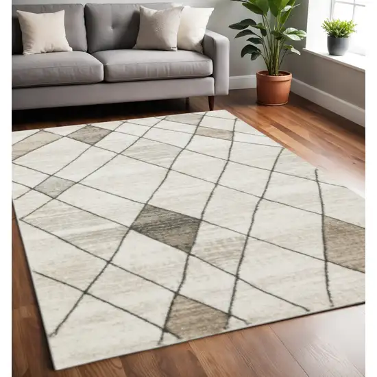Beige Grey Tan And Brown Geometric Power Loom Stain Resistant Area Rug Photo 1