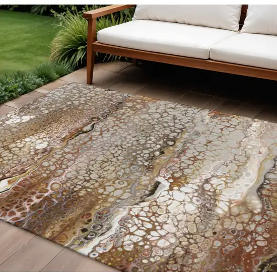 Beige Ivory And Black Abstract Washable Indoor Outdoor Area Rug Photo 1