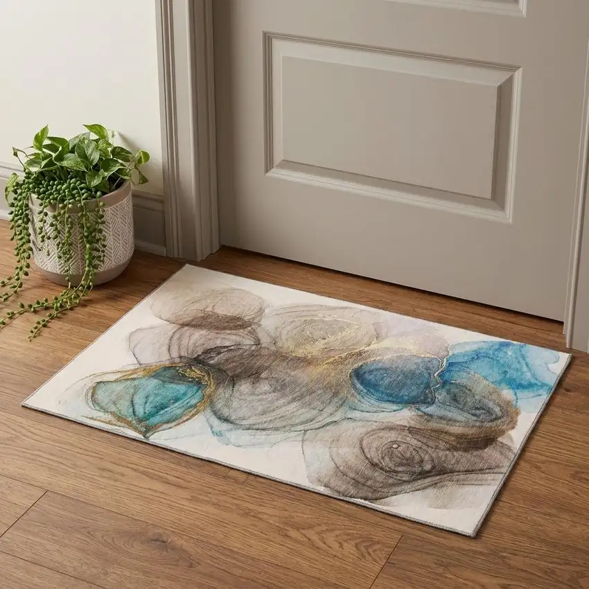 Beige Ivory And Blue Abstract Washable Area Rug With UV Protection Photo 1