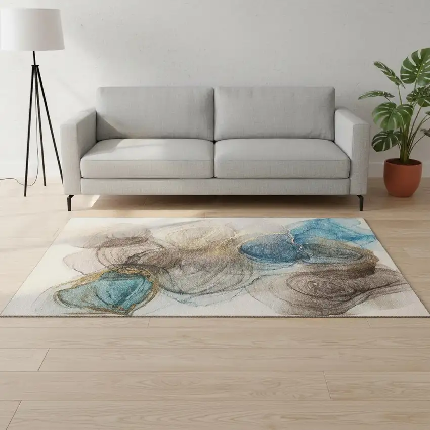 Beige Ivory And Blue Abstract Washable Area Rug With UV Protection Photo 1