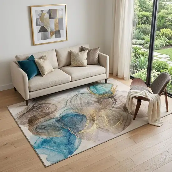 Beige Ivory And Blue Abstract Washable Area Rug With UV Protection Photo 1