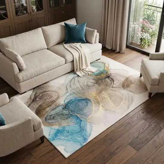 Beige Ivory And Blue Abstract Washable Area Rug With UV Protection Photo 1