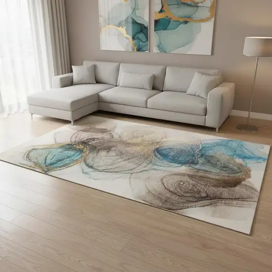 Beige Ivory And Blue Abstract Washable Area Rug With UV Protection Photo 1