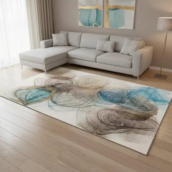 Beige Ivory And Blue Abstract Washable Area Rug With UV Protection Photo 1