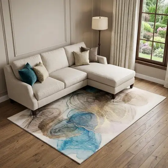 Beige Ivory And Blue Abstract Washable Area Rug With UV Protection Photo 1