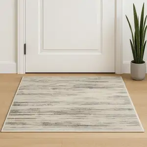 Photo of Beige Ivory And Brown Abstract Distressed Area Rug