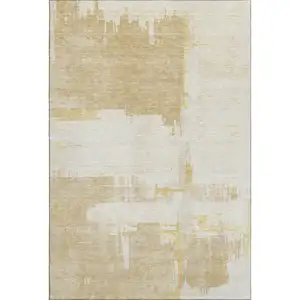 Photo of Beige Ivory And Gold Abstract Washable Area Rug With UV Protection