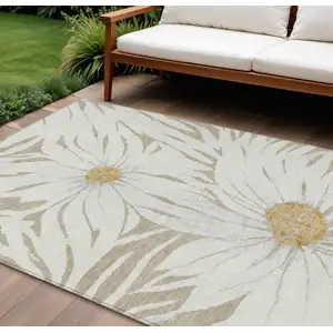 Photo of Beige Ivory And Gold Floral Washable Indoor Outdoor Area Rug