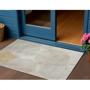 Photo of Beige Ivory And Gold Geometric Washable Indoor Outdoor Area Rug