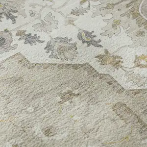 Photo of Beige Ivory And Gold Oriental Washable Area Rug With UV Protection