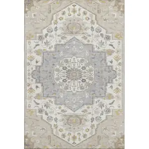 Photo of Beige Ivory And Gold Oriental Washable Area Rug With UV Protection