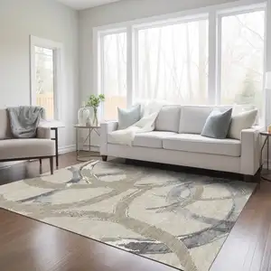 Photo of Beige Ivory And Gray Abstract Washable Indoor Outdoor Area Rug