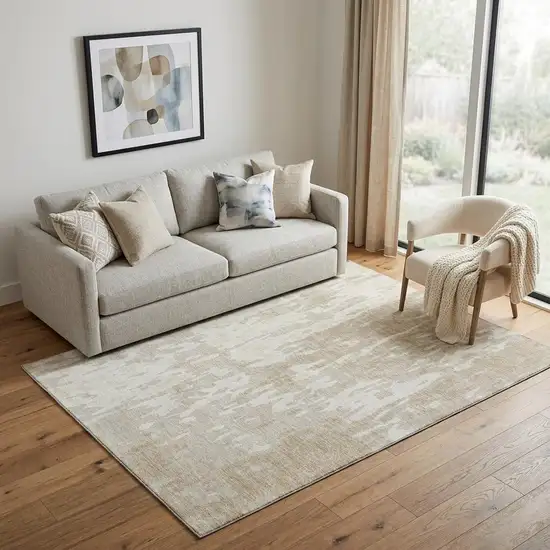 Beige Ivory And Tan Abstract Washable Area Rug With UV Protection Photo 1