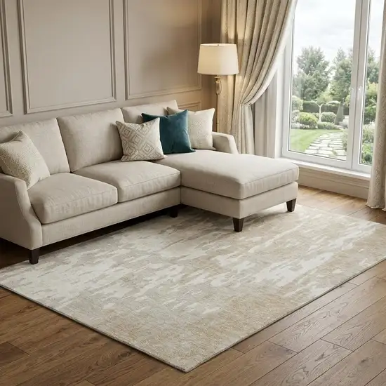 Beige Ivory And Tan Abstract Washable Area Rug With UV Protection Photo 1