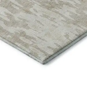 Photo of Beige Ivory And Tan Abstract Washable Area Rug With UV Protection