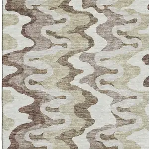 Photo of Beige Ivory And Taupe Abstract Washable Area Rug With UV Protection