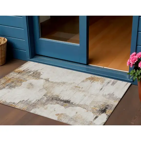 Beige Ivory And Taupe Abstract Washable Indoor Outdoor Area Rug Photo 1