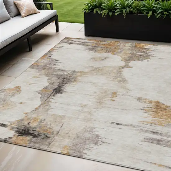 Beige Ivory And Taupe Abstract Washable Indoor Outdoor Area Rug Photo 1