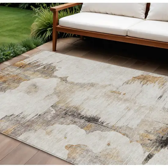 Beige Ivory And Taupe Abstract Washable Indoor Outdoor Area Rug Photo 1