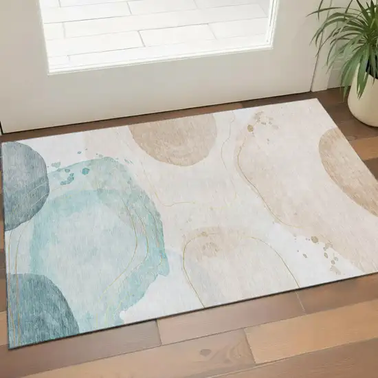 Beige Ivory And Teal Abstract Washable Area Rug With UV Protection Photo 1