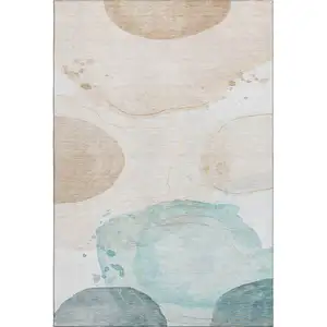 Photo of Beige Ivory And Teal Abstract Washable Area Rug With UV Protection