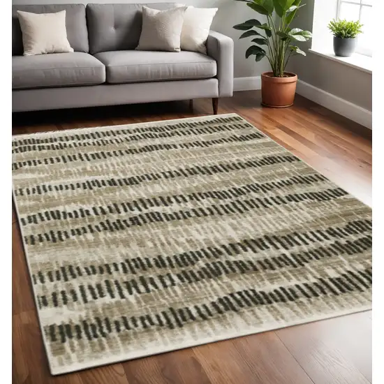 Beige Ivory Charcoal Brown Tan And Grey Abstract Power Loom Stain Resistant Area Rug With Fringe Photo 1