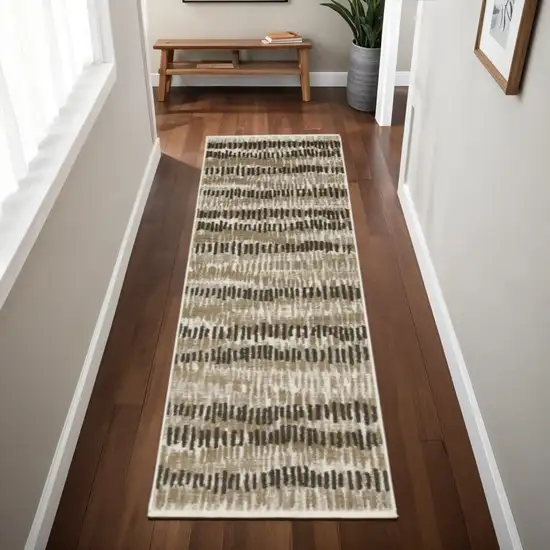 2' X 8' Beige Ivory Charcoal Brown Tan And Grey Abstract Power Loom Stain Resistant Runner Rug With Fringe Photo 1