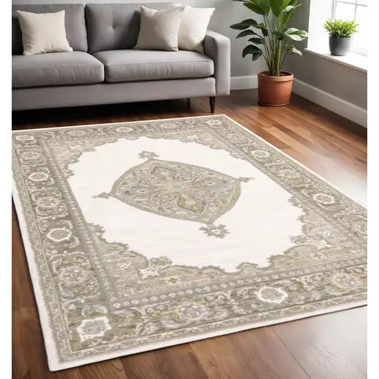 Beige And Ivory Oriental Area Rug Photo 1