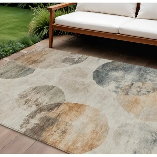 Beige Khaki And Ivory Abstract Washable Indoor Outdoor Area Rug Photo 1