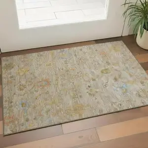 Photo of Beige Orange And Blue Floral Washable Area Rug With UV Protection
