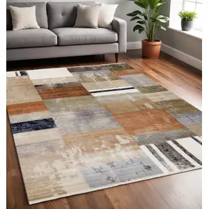 Photo of Beige Orange And Brown Geometric Area Rug