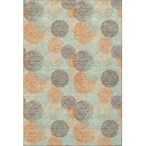 Photo of Beige Orange And Ivory Abstract Washable Area Rug With UV Protection